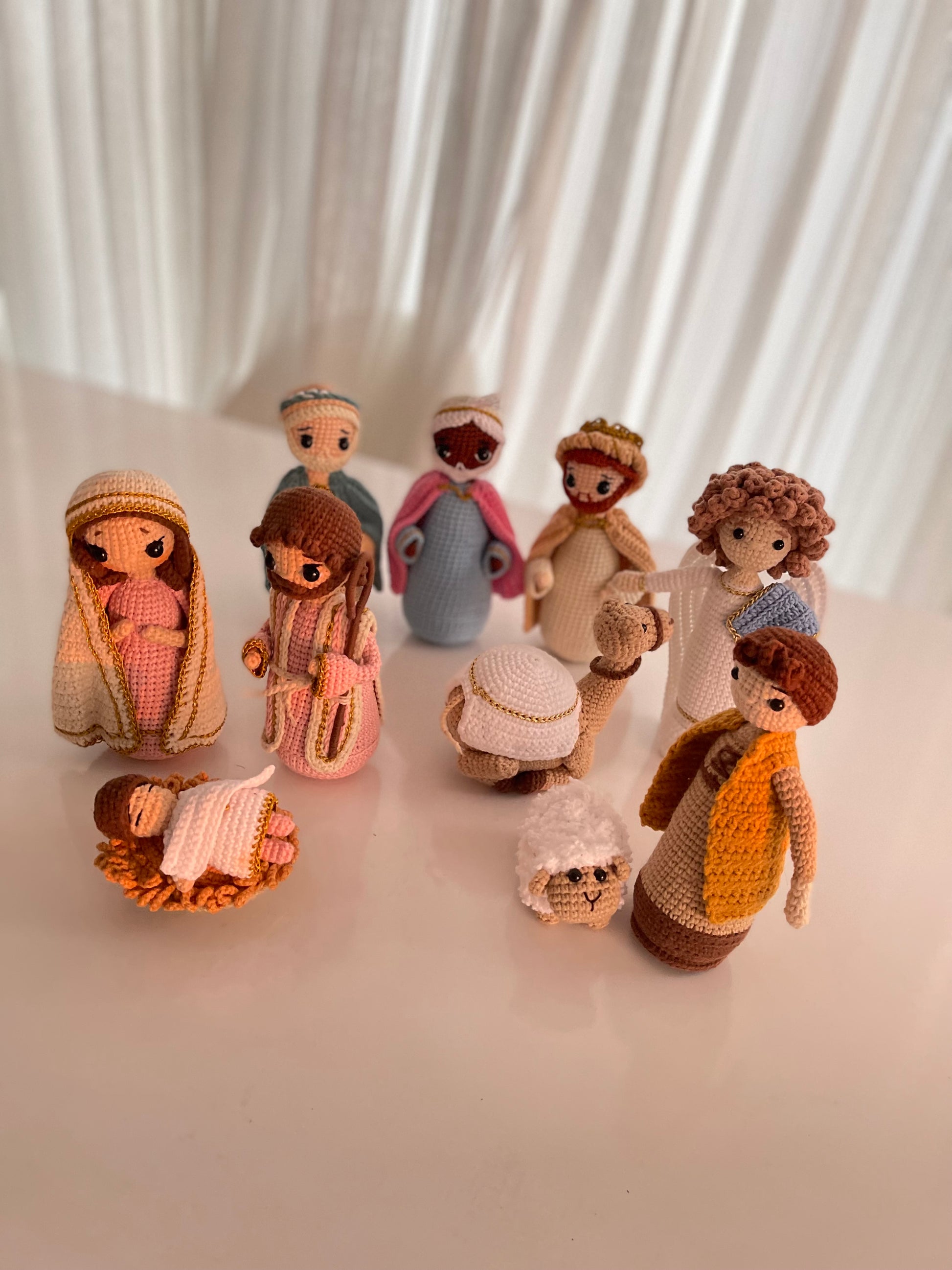 Close-up of the hand-crocheted Nativity set, highlighting the intricate details of each character and animal