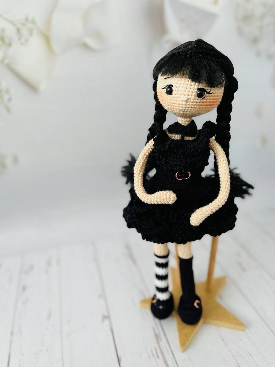 Crocheted Wednesday doll featuring movable wire arms for iconic poses and dances