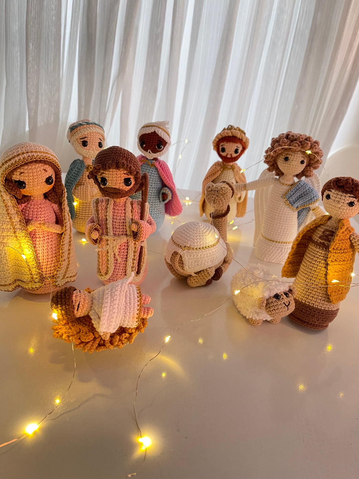 A beautifully detailed, handmade crochet Nativity scene featuring all the key figures of the Christmas story