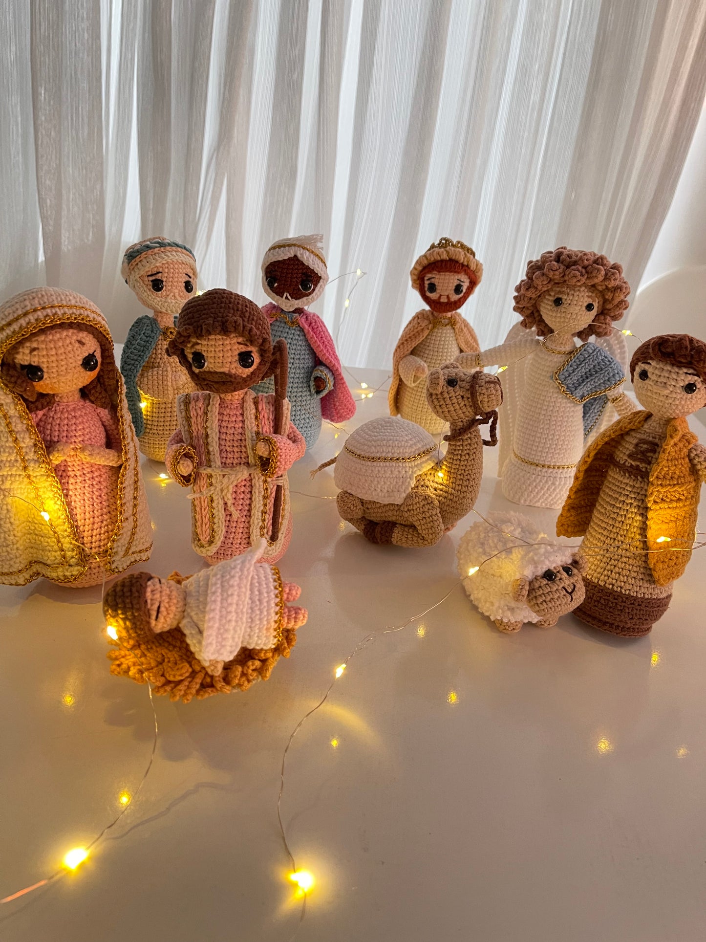 Hand-crocheted Christmas Nativity set with Mary, Joseph, Baby Jesus in a manger, three wise men, a shepherd, sheep, and a camel