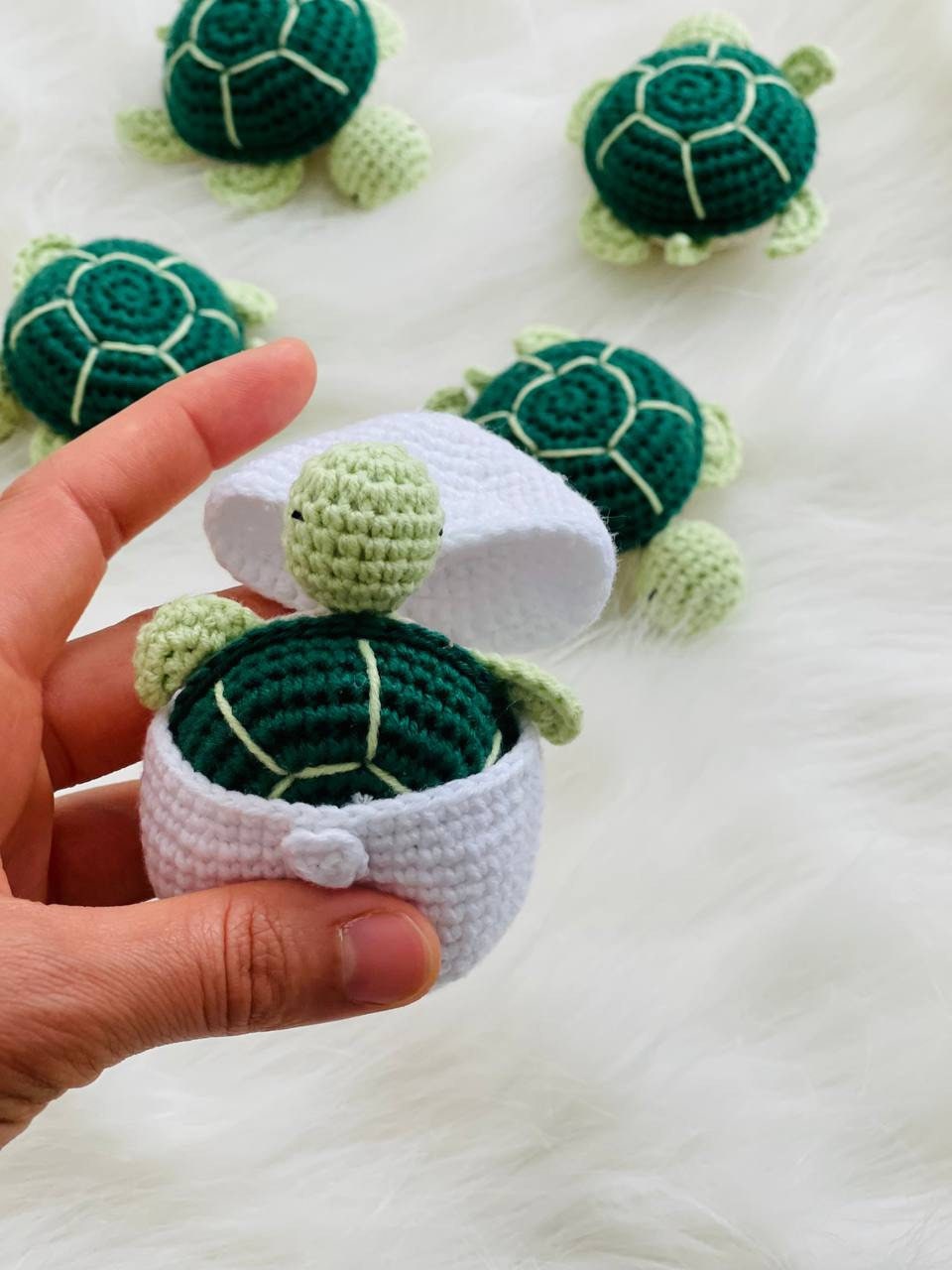 Handmade crochet baby turtle with its own egg, perfect for any turtle lover.The adorable turtle is meticulously crafted with soft and colorful yarn, and comes nestled inside a crocheted egg. Ideal as a baby shower gift or nursery decor.