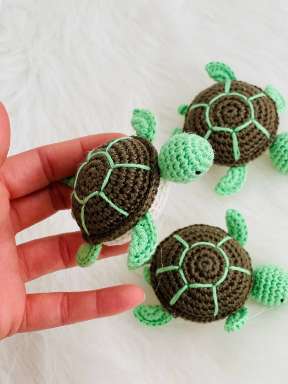 Handmade crochet baby turtle with its own egg, perfect for any turtle lover.The adorable turtle is meticulously crafted with soft and colorful yarn, and comes nestled inside a crocheted egg. Ideal as a baby shower gift or nursery decor.