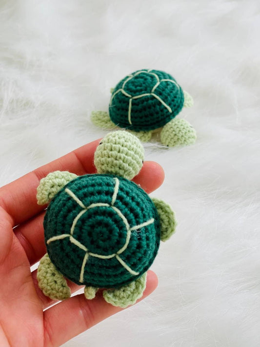 Handmade crochet baby turtle with its own egg, perfect for any turtle lover.The adorable turtle is meticulously crafted with soft and colorful yarn, and comes nestled inside a crocheted egg. Ideal as a baby shower gift or nursery decor.