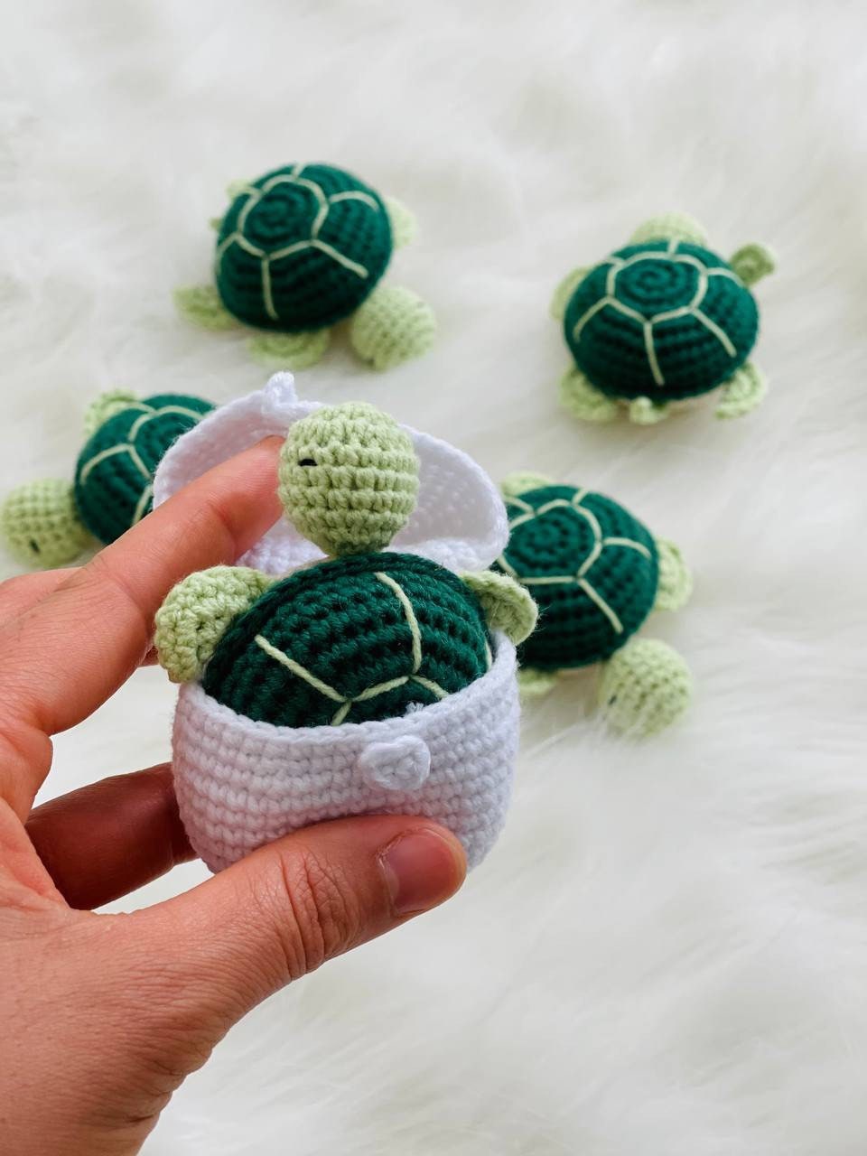 Handmade crochet baby turtle with its own egg, perfect for any turtle lover.The adorable turtle is meticulously crafted with soft and colorful yarn, and comes nestled inside a crocheted egg. Ideal as a baby shower gift or nursery decor.