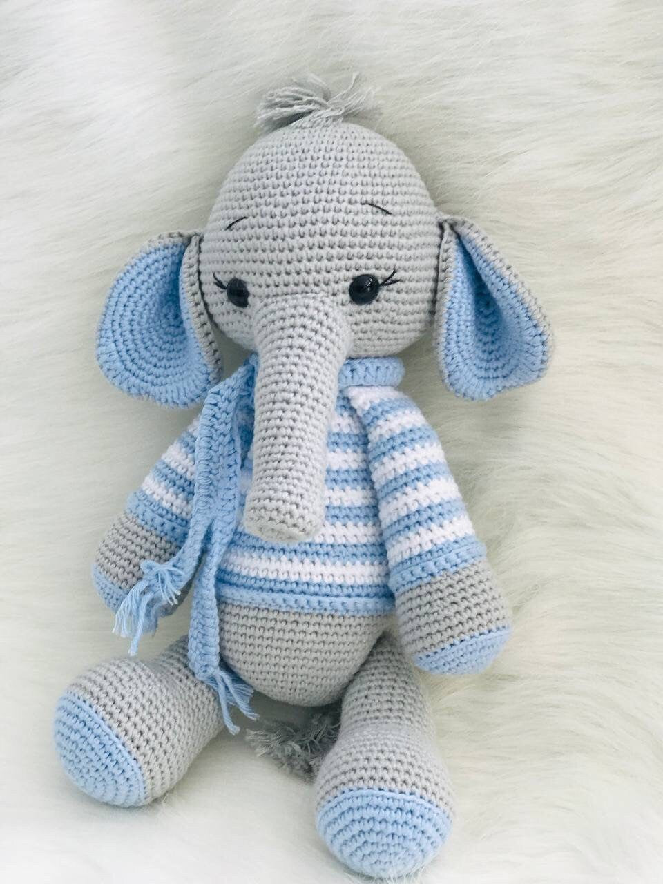 This crocheted elephant's craftsmanship and attention to detail are evident from the striped tusks down to the swirly patterned stripes. What's more impressive is how symmetrical this creature is; every stripe perfectly parallels another.