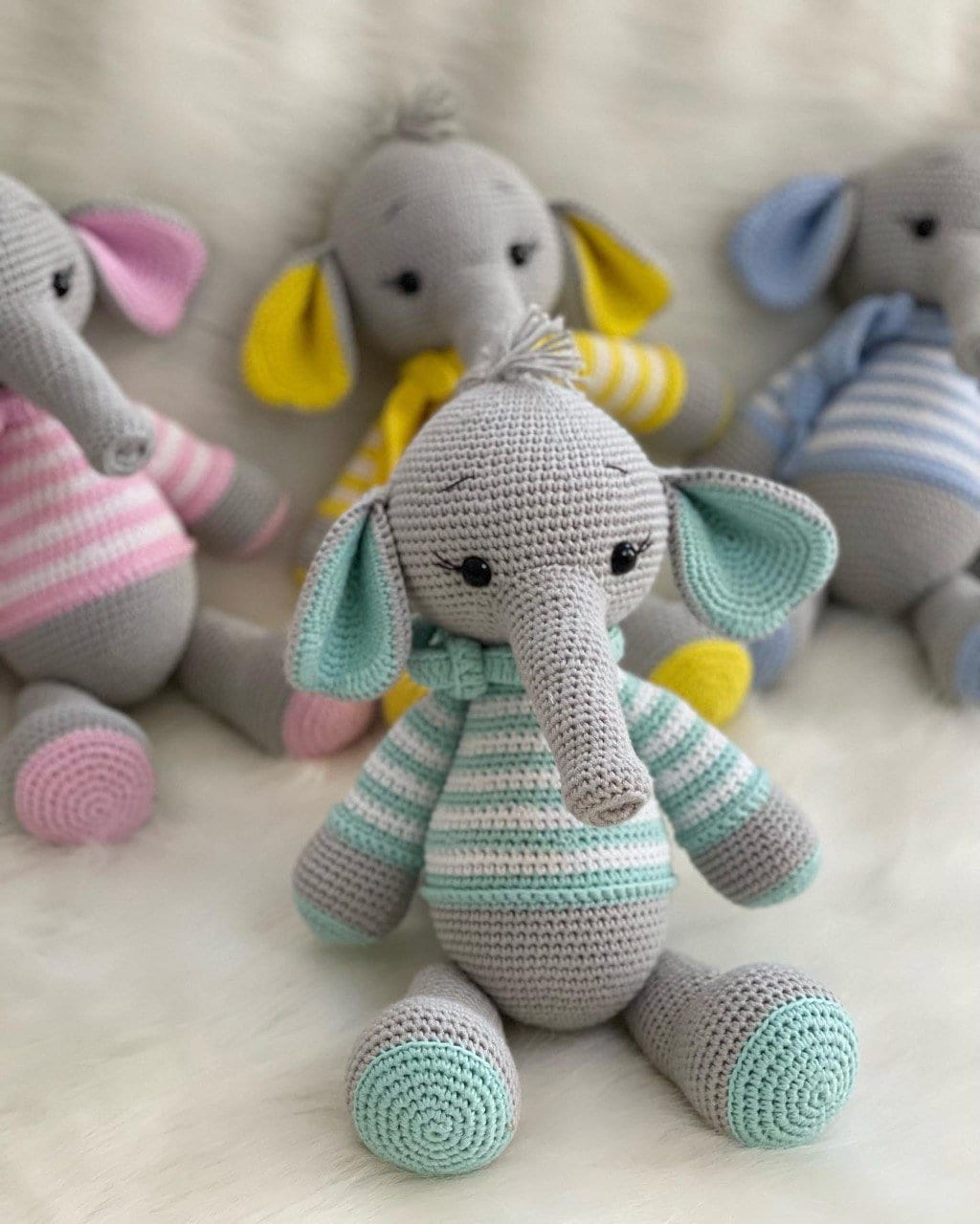 This crocheted elephant's craftsmanship and attention to detail are evident from the striped tusks down to the swirly patterned stripes. What's more impressive is how symmetrical this creature is; every stripe perfectly parallels another.
