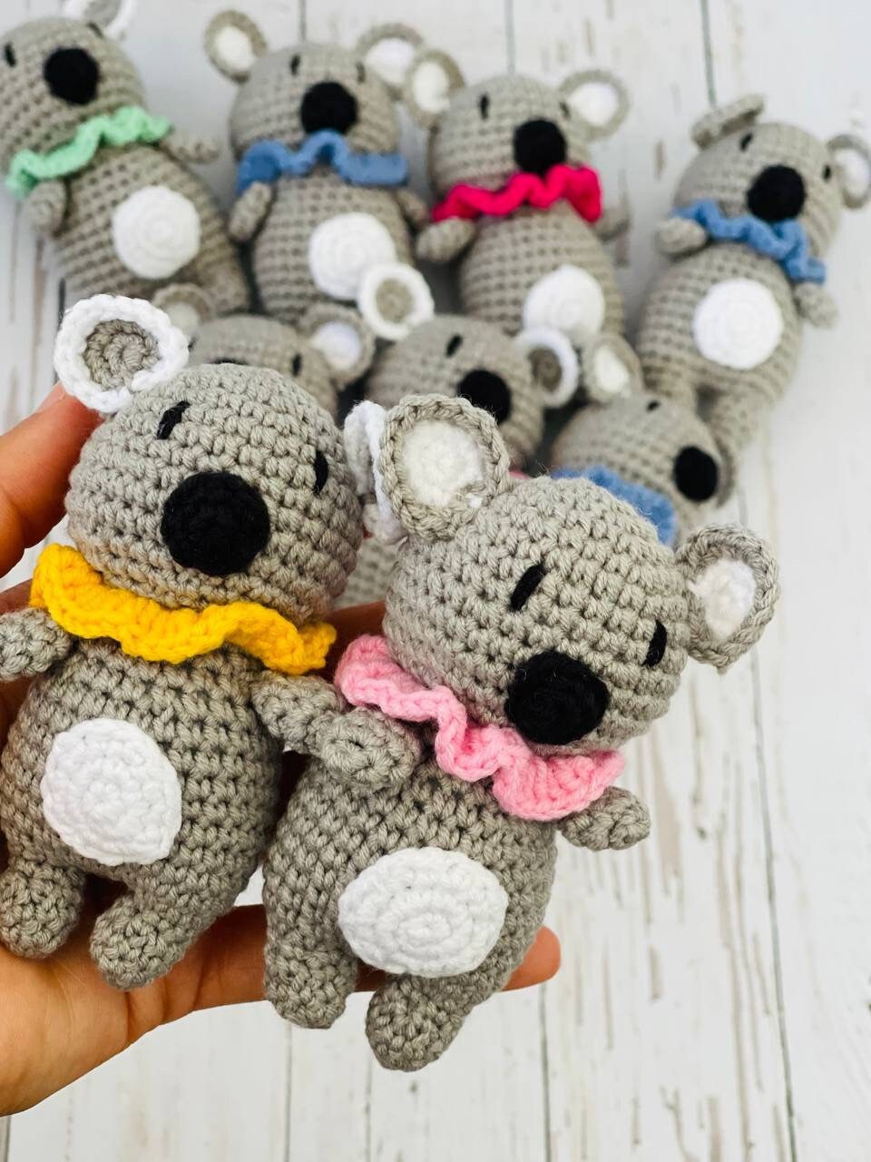 Photo of handmade crochet miniatures cute and colorful animals including a bee, cow, panda, piglet, and koala. Perfect as a unique gift or collectible item.Each crochet animal is crafted using soft yarn and stuffed with hypoallergenic filling
