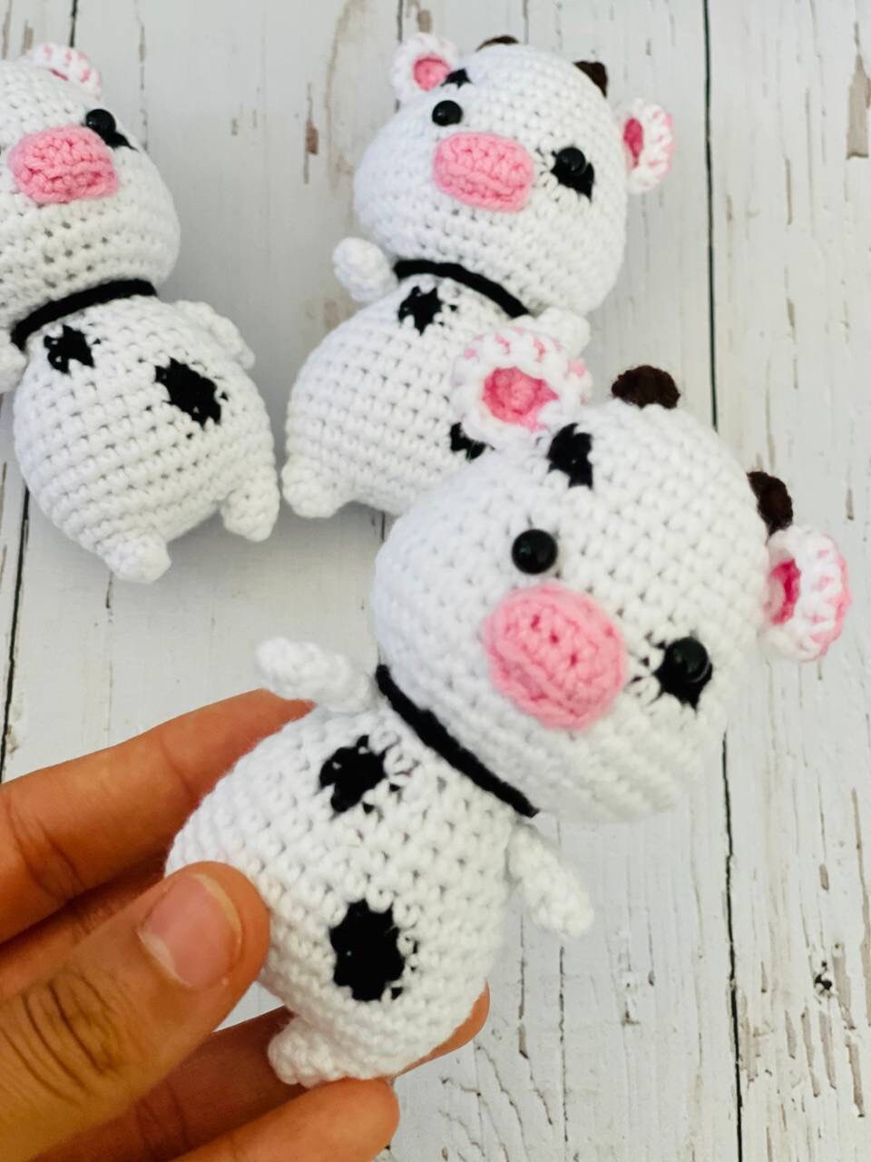 Photo of handmade crochet miniatures cute and colorful animals including a bee, cow, panda, piglet, and koala. Perfect as a unique gift or collectible item.Each crochet animal is crafted using soft yarn and stuffed with hypoallergenic filling