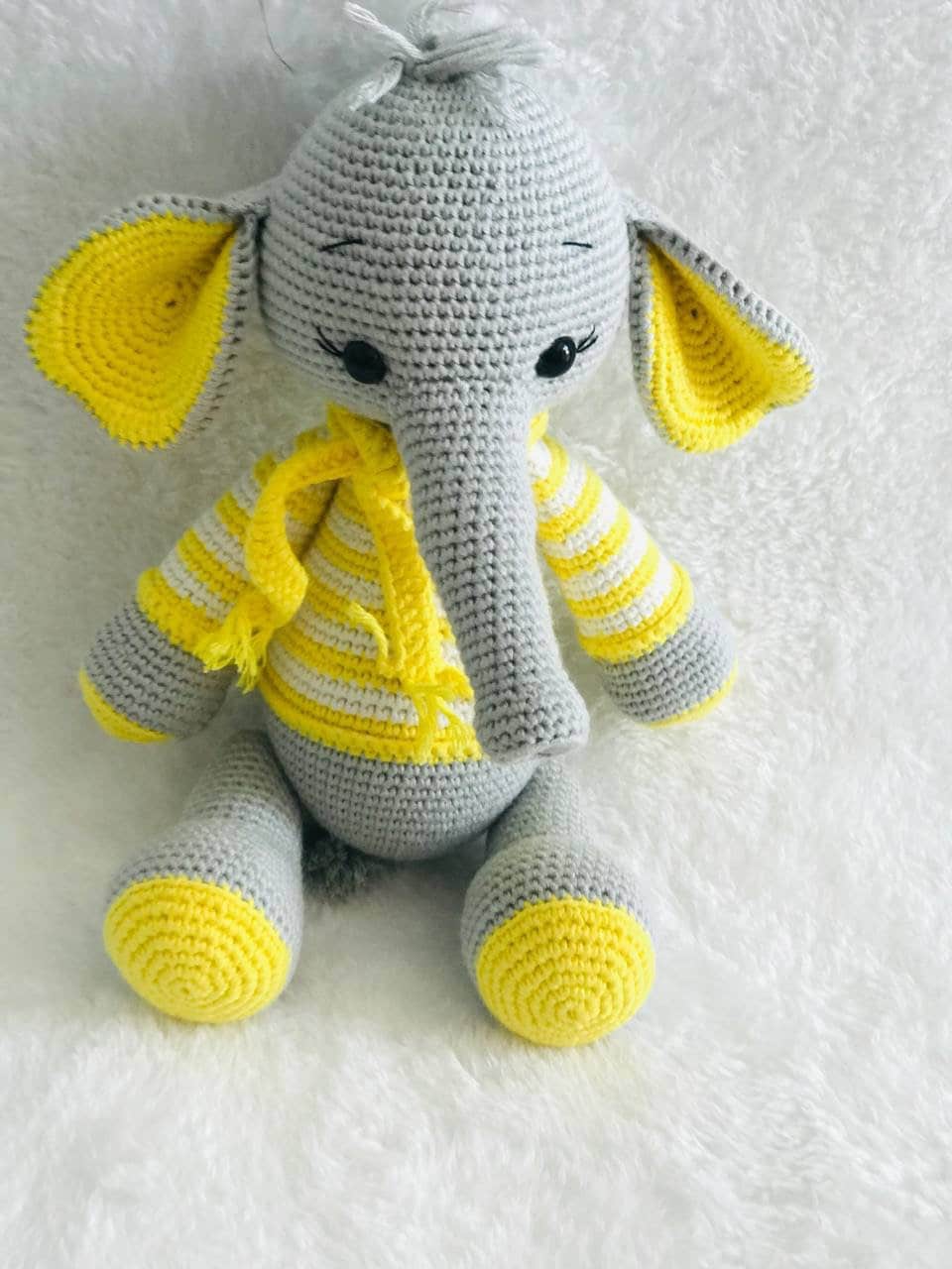 A charming crochet elephant toy with a detailed, hand-stitched finish