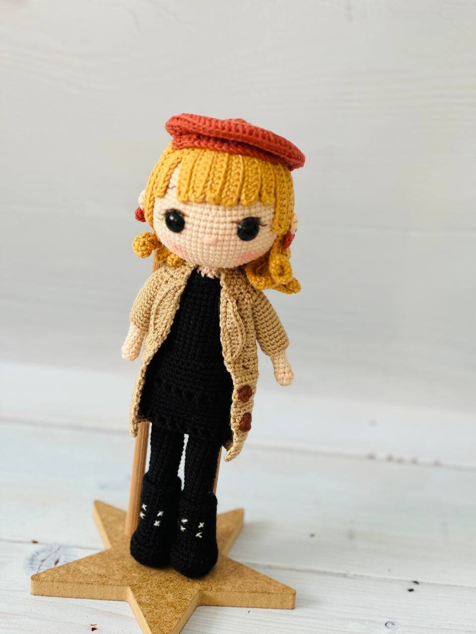 Handmade Taylor Swift crochet doll with blonde curls and a stylish outfit.