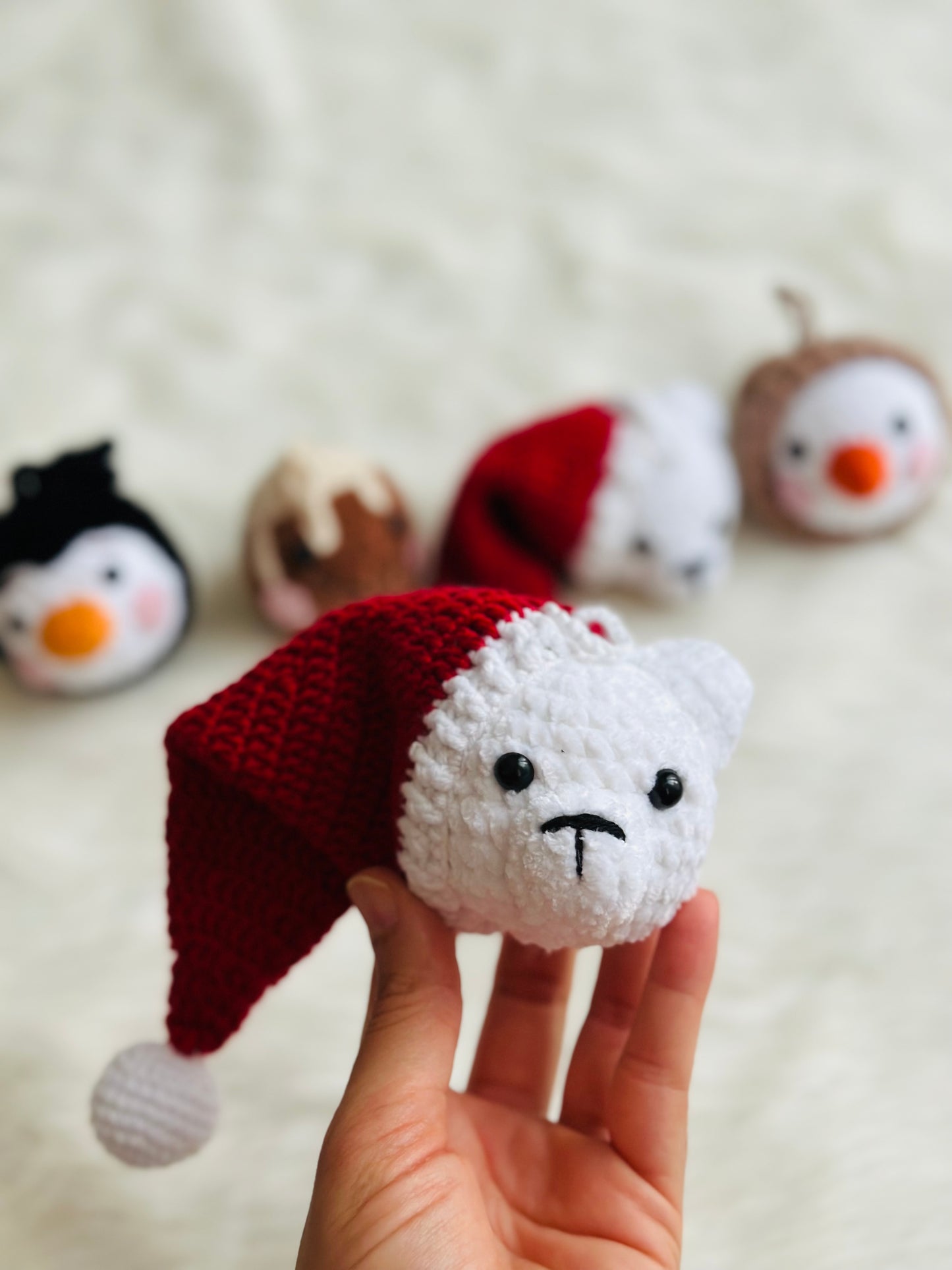 Cute crochet snowman, pudding, penguin , polar bear tree decorations .