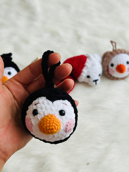 Cute crochet snowman, pudding, penguin , polar bear tree decorations .
