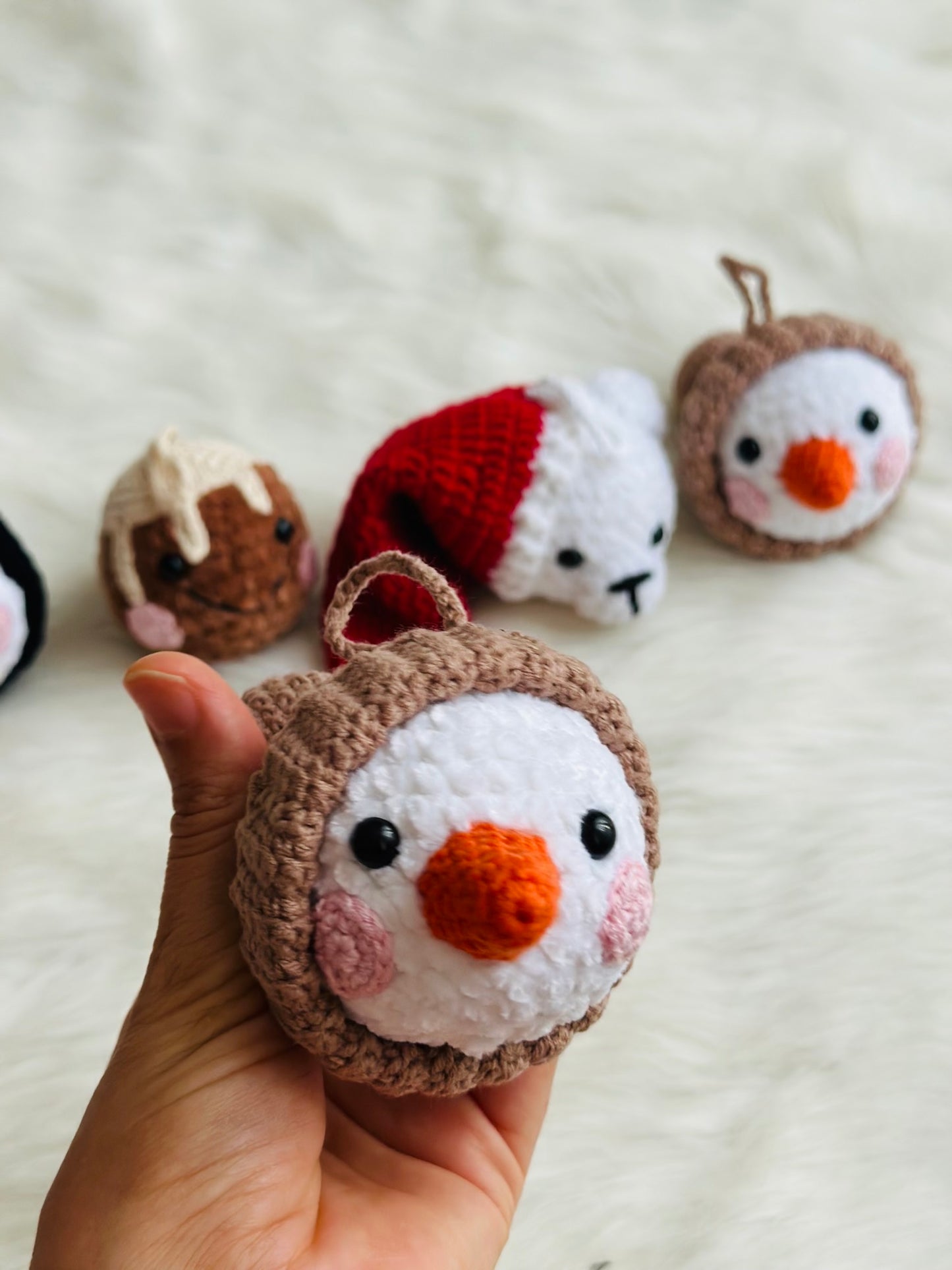 Cute crochet snowman, pudding, penguin , polar bear tree decorations .