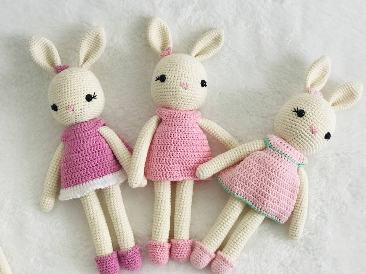 A collection of handmade bunnies in dreamy pastel hues, perfect for spring