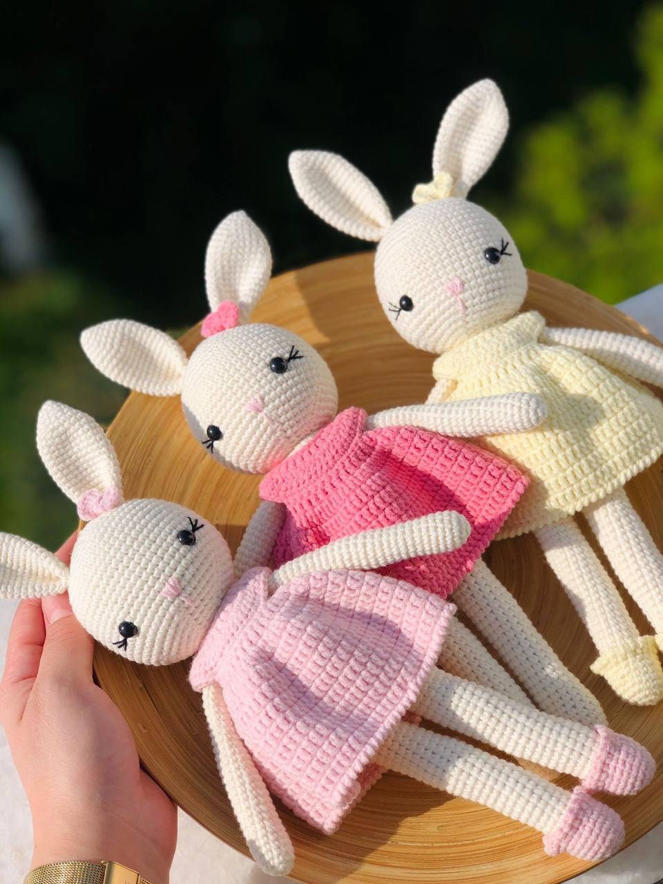 A collection of sweet pastel Amigurumi bunnies with perky ears and fluffy tails.