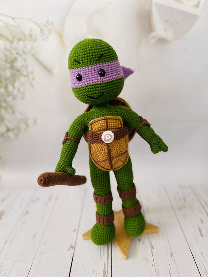 Hand-crocheted set of Teenage Mutant Ninja Turtles: Leonardo, Donatello, Michelangelo, and Raphael.