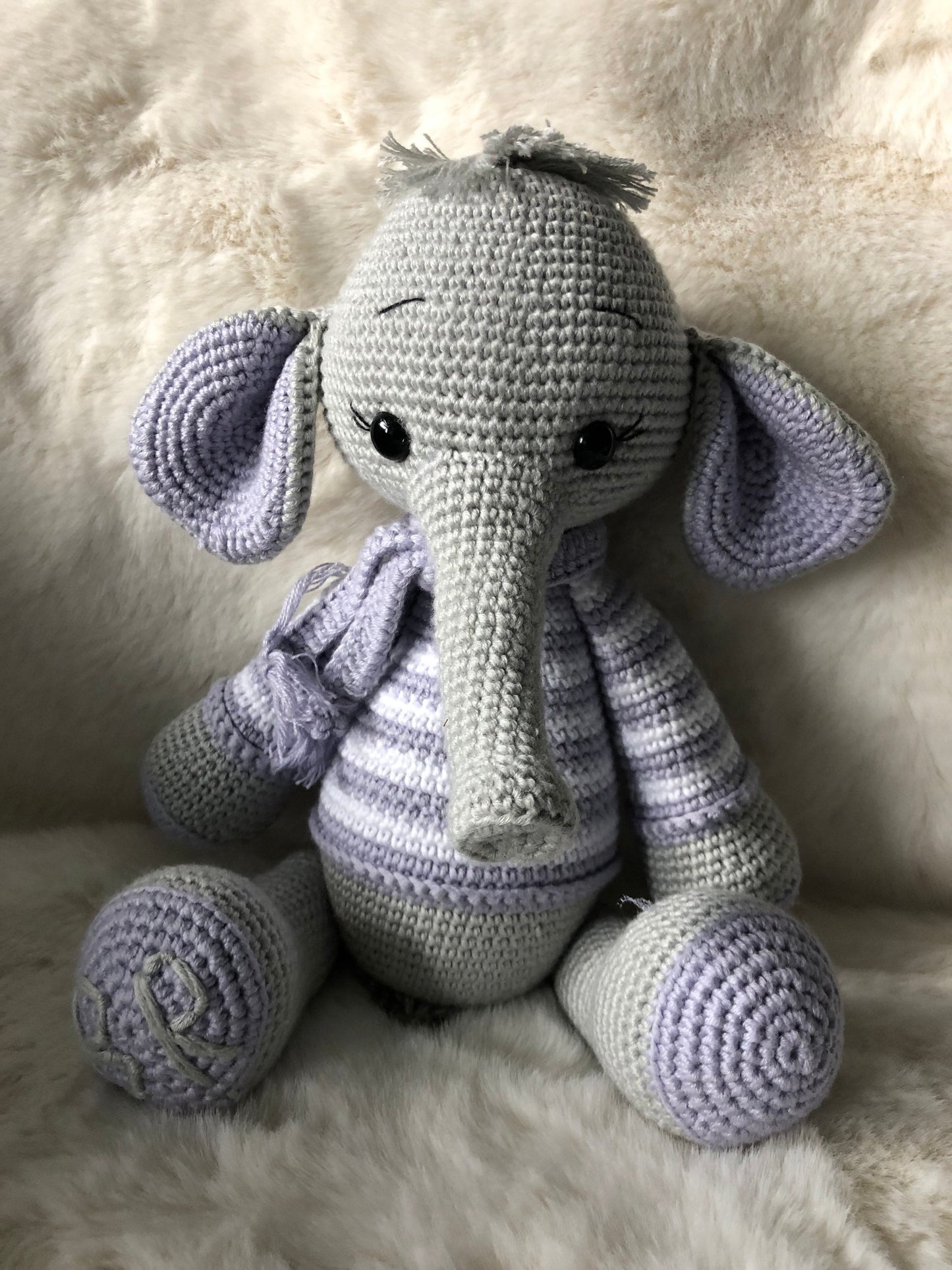 A soft and cuddly crochet elephant, ideal as a baby gift or a comforting toy for children