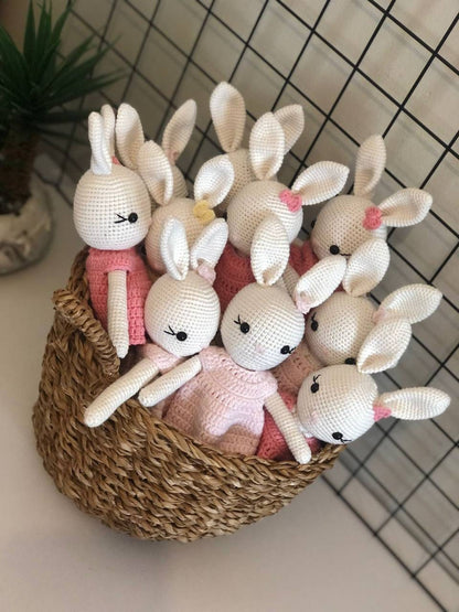 Handmade pastel rabbits with attention to detail in their crocheted dresses.