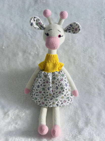 Close-up of a handmade crochet giraffe toy showing its soft yarn and intricate stitching