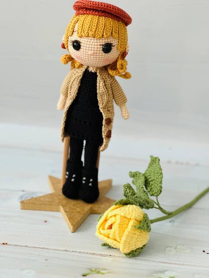 Close-up of a meticulously crocheted Taylor Swift doll with attention to detail in her features and clothing.