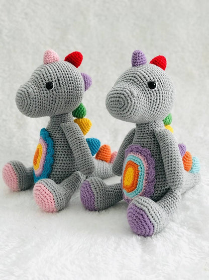 Handmade crochet baby dinosaur toy with soft yarn and embroidered features Cute and cuddly crochet baby dinosaur with embroidered details Small handmade crochet dinosaur toy for babies and toddlers Adorable crochet dinosaur with embroidered eyes