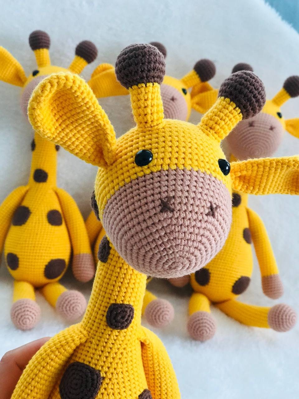 The crocheting is intricate, with the tan and brown shades working together to make an accurate representation of a real giraffe. The full-sized plush toy stands almost 40 cm tall. This will fit right into safari theme decor