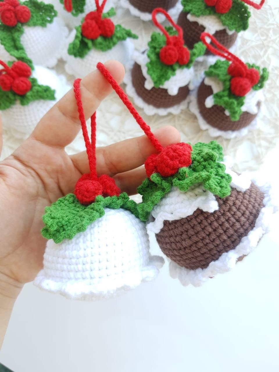 Crochet Christmas pudding ornament with chocolate and white colors, perfect for decorating your tree or adding a touch of holiday charm to your home decor. Handmade with love, this cute piece is sure to delight anyone who loves the festive season