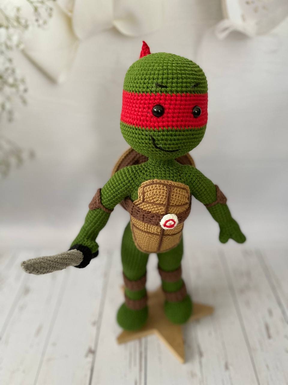 The Cowabunga crew in crochet form: Leonardo with his swords, Donatello with his bo staff, Michelangelo with his nunchucks, and Raphael with his sai.
